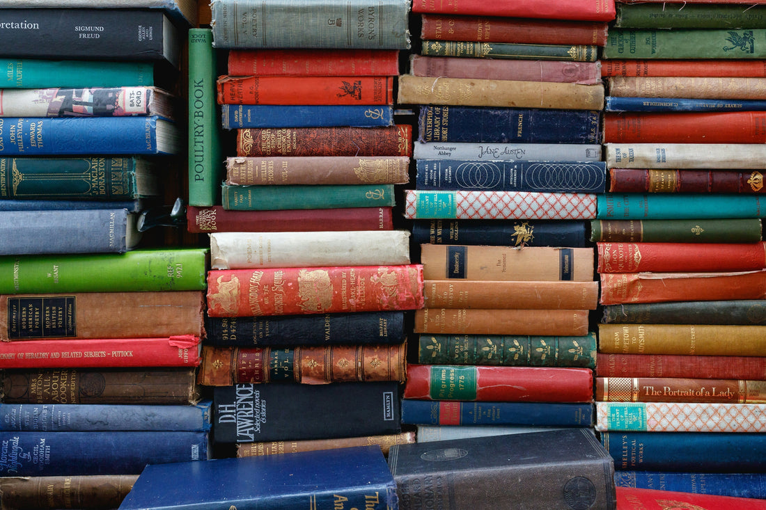 Pile of books. Photo by Ed Robertson on Unsplash [https://unsplash.com/@eddrobertson] 