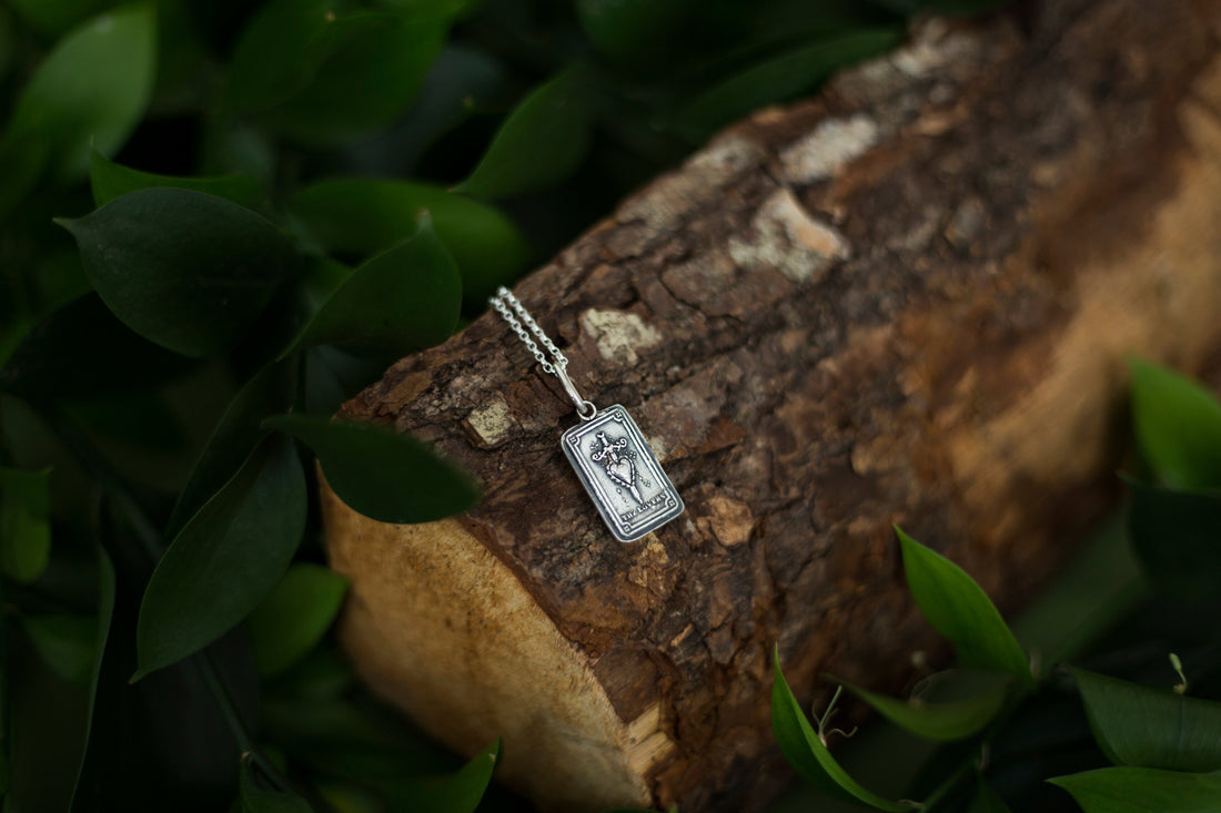 Dark silver textured necklace on neutral background
