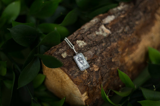 Dark silver textured necklace on neutral background