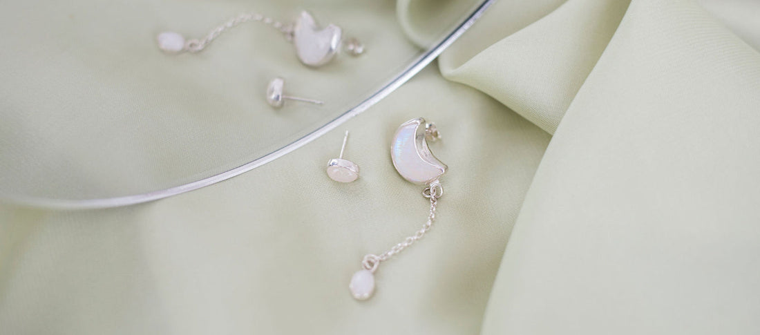 Moonstone earrings in sterling silver, natural light flat lay