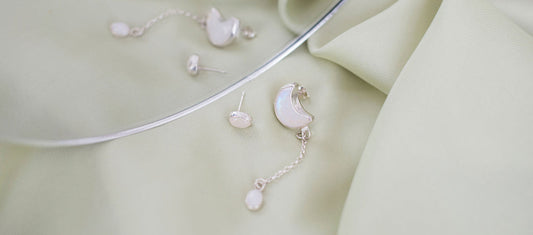 Moonstone earrings in sterling silver, natural light flat lay