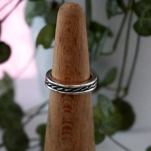 Beau ring on mandrel with plant in background