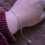 Heart chain wrapped around wrist to create a bracelet
